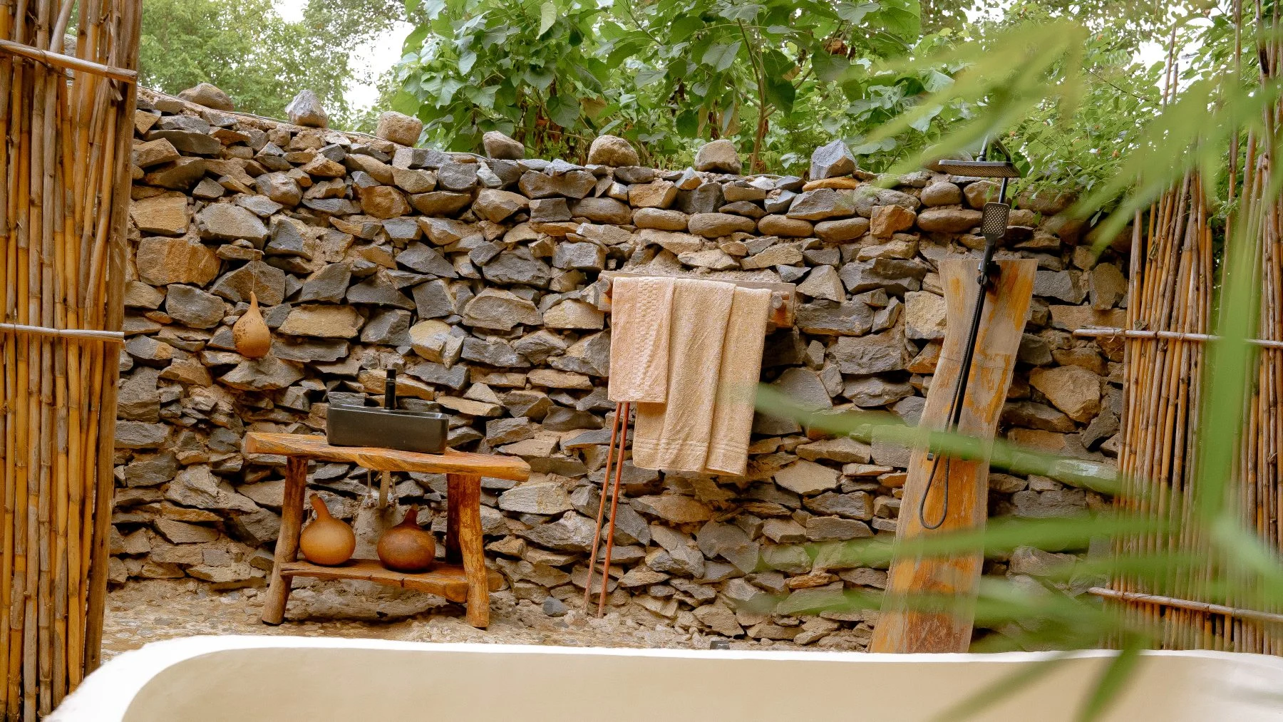 A stone outdoor bath in a guest room at Sio Maasai