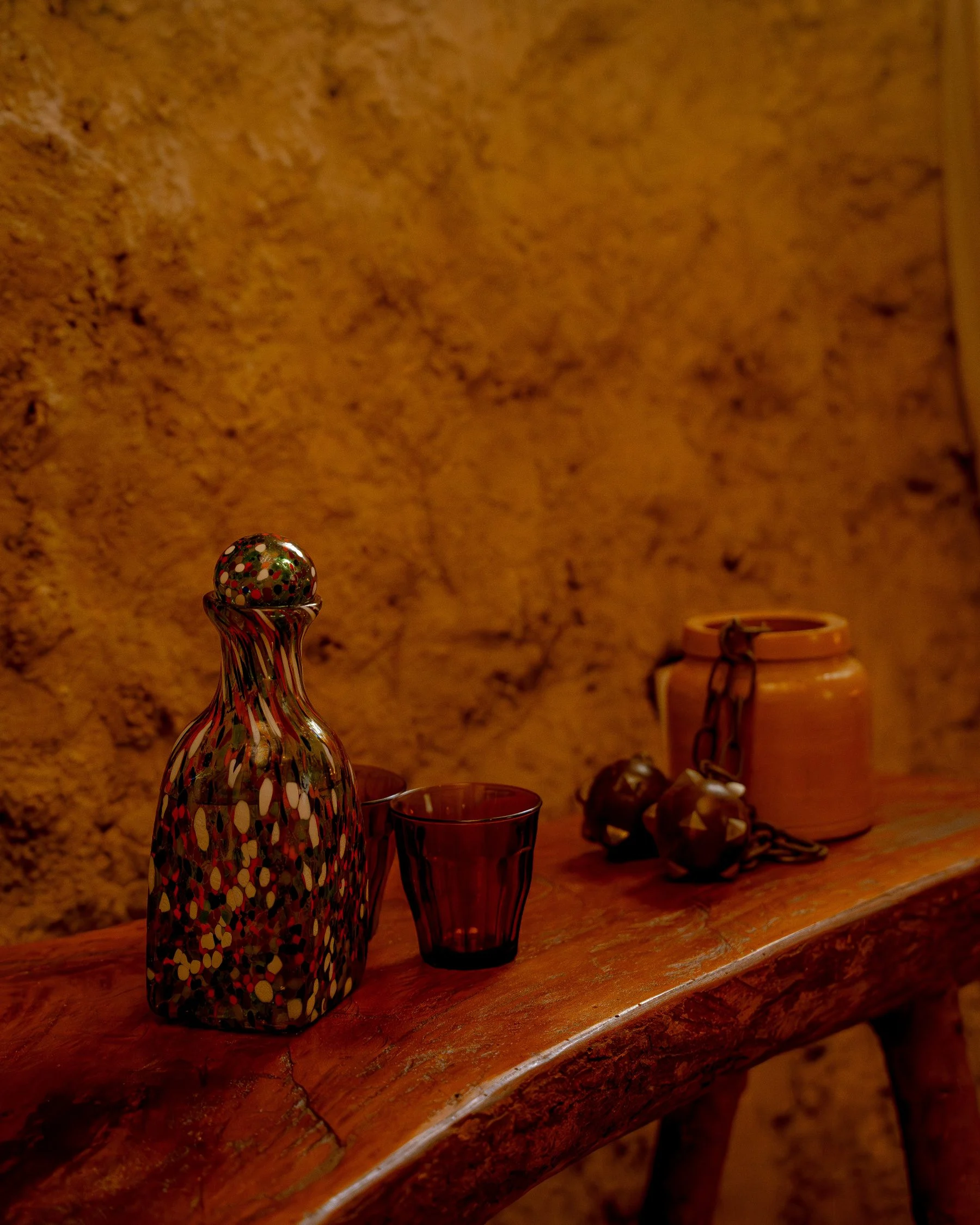 A water carafe and glass on a bedside table at Sio Maasai